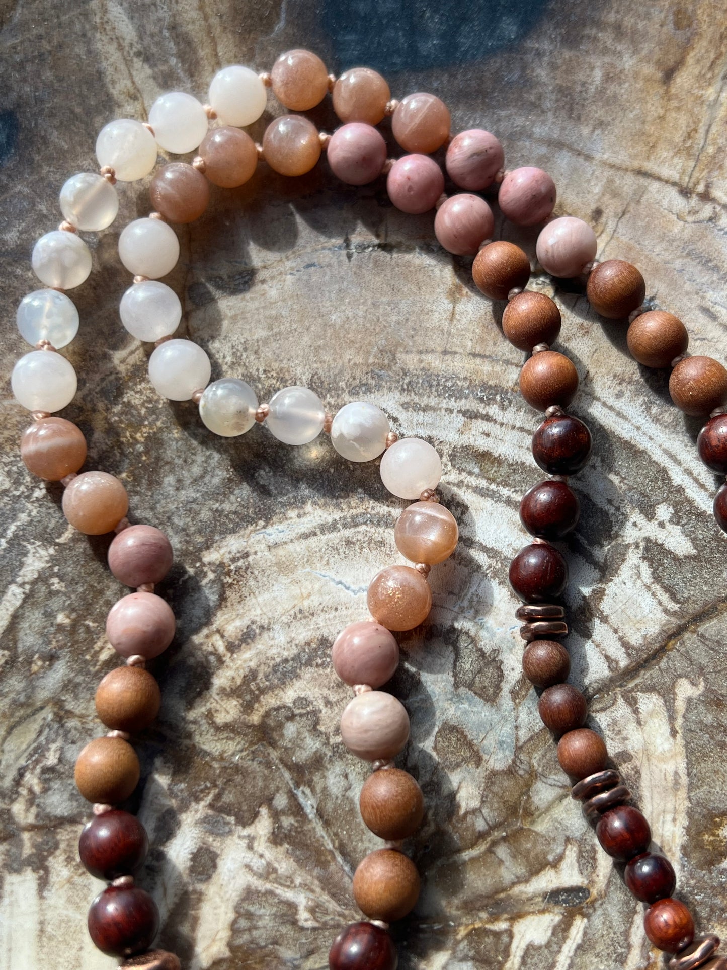 Half Mālā with Sunstone, Haitian Flower Rhodonite and Cherry Blossom Agate, Sandalwood, Indian Rosewood and Peach Aventurine with a Thai Buddha Pendant
