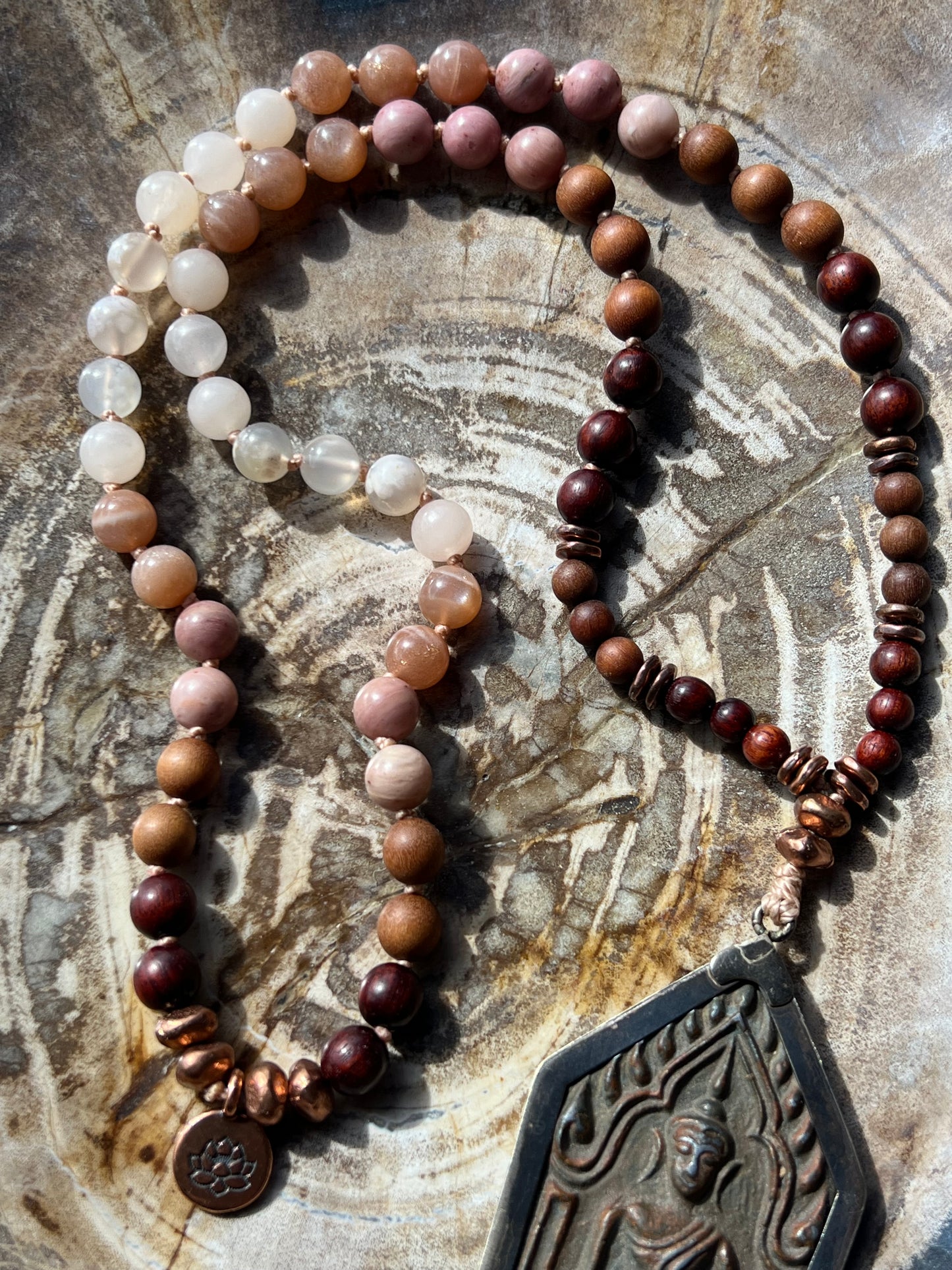 Half Mālā with Sunstone, Haitian Flower Rhodonite and Cherry Blossom Agate, Sandalwood, Indian Rosewood and Peach Aventurine with a Thai Buddha Pendant