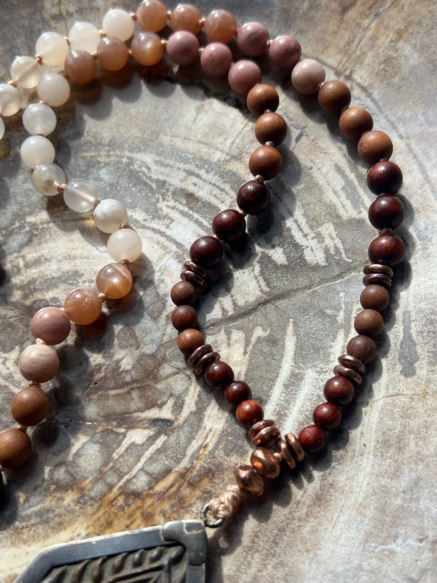 Half Mālā with Sunstone, Haitian Flower Rhodonite and Cherry Blossom Agate, Sandalwood, Indian Rosewood and Peach Aventurine with a Thai Buddha Pendant