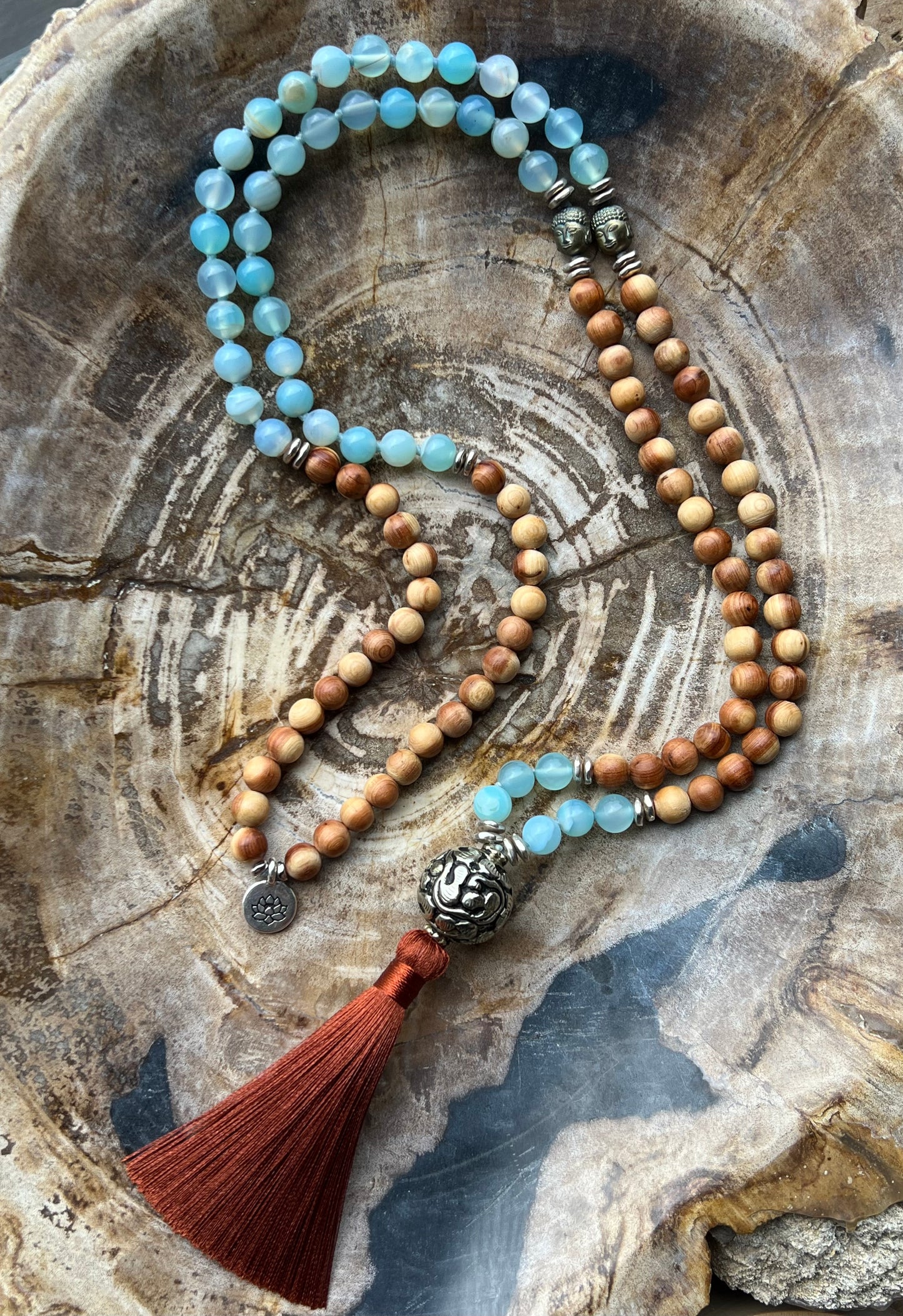 Mālā with Lake Blue Agate and Pearwood Beads with a Nepalese Silver Guru Bead, and a silky Tassel