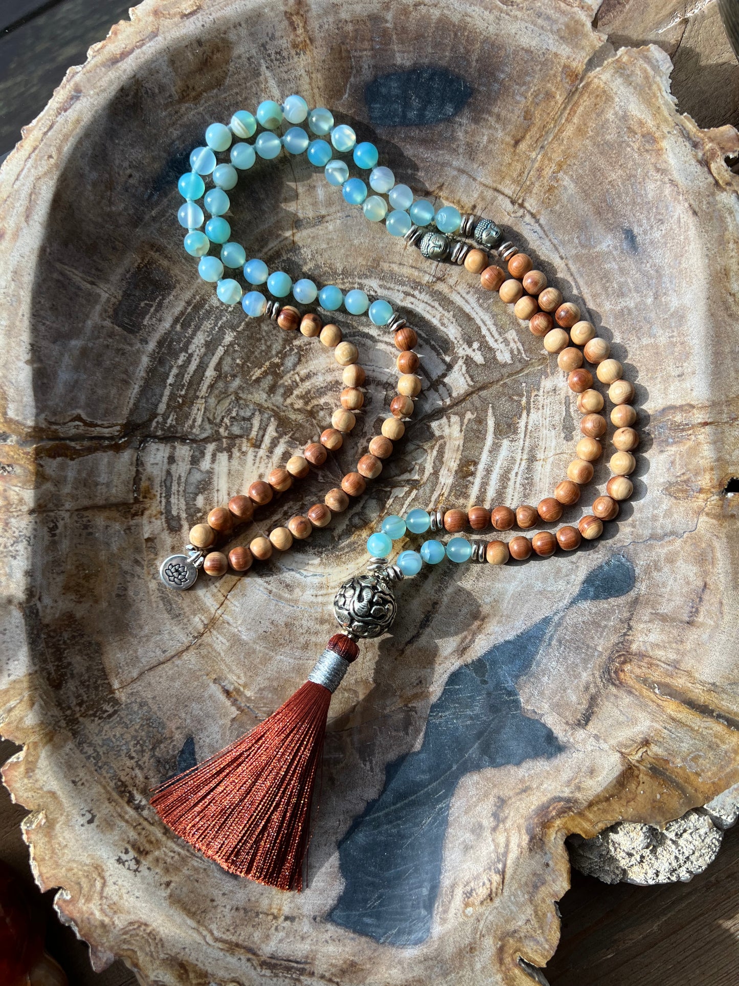 Mālā with Lake Blue Agate and Pearwood Beads with a Nepalese Silver Guru Bead, and a silky Tassel