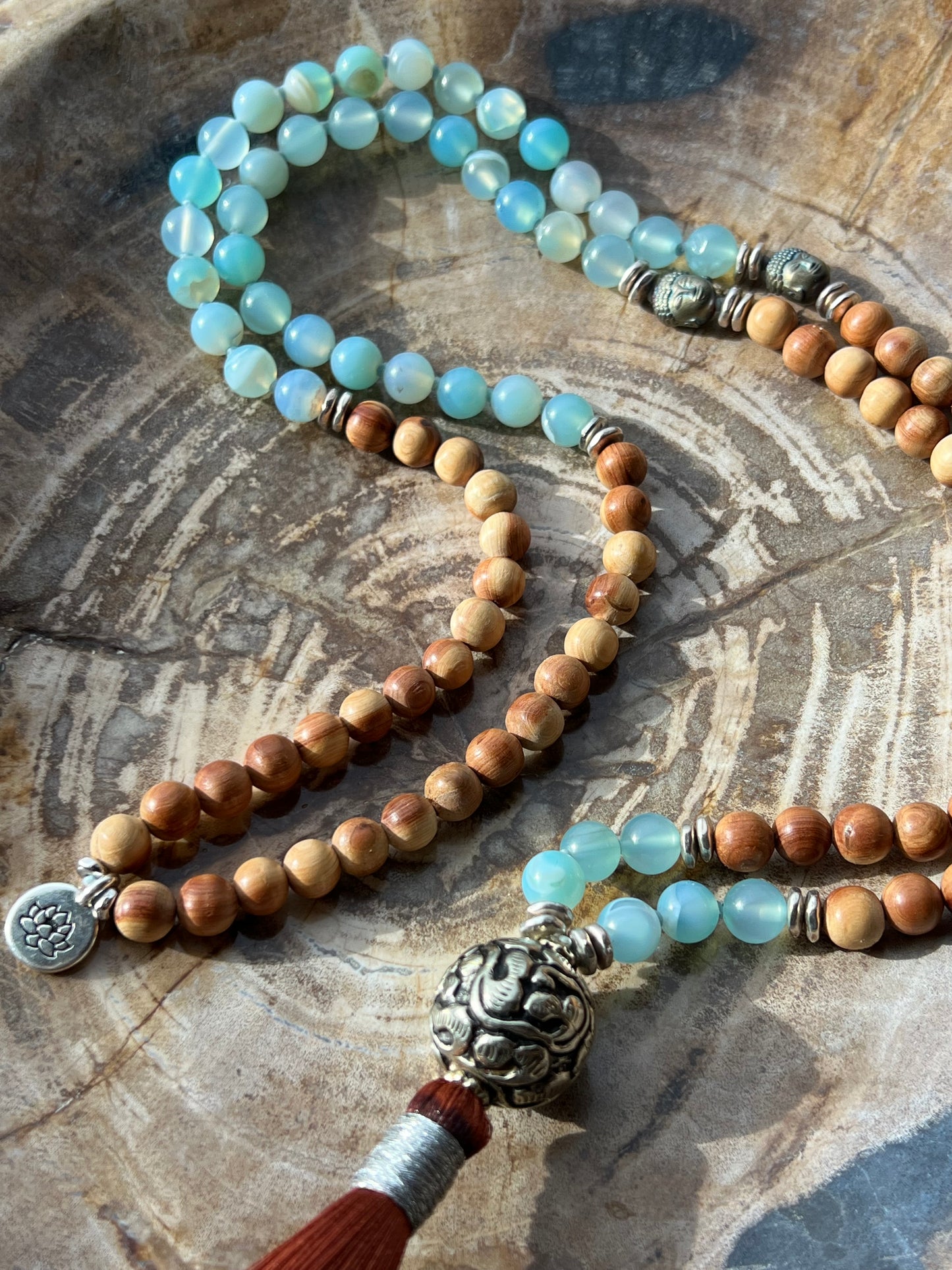 Mālā with Lake Blue Agate and Pearwood Beads with a Nepalese Silver Guru Bead, and a silky Tassel