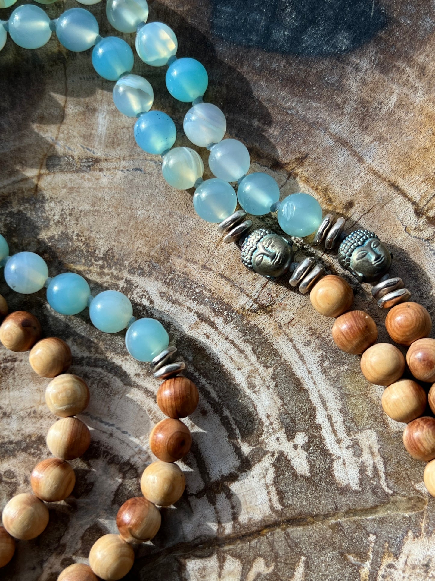 Mālā with Lake Blue Agate and Pearwood Beads with a Nepalese Silver Guru Bead, and a silky Tassel