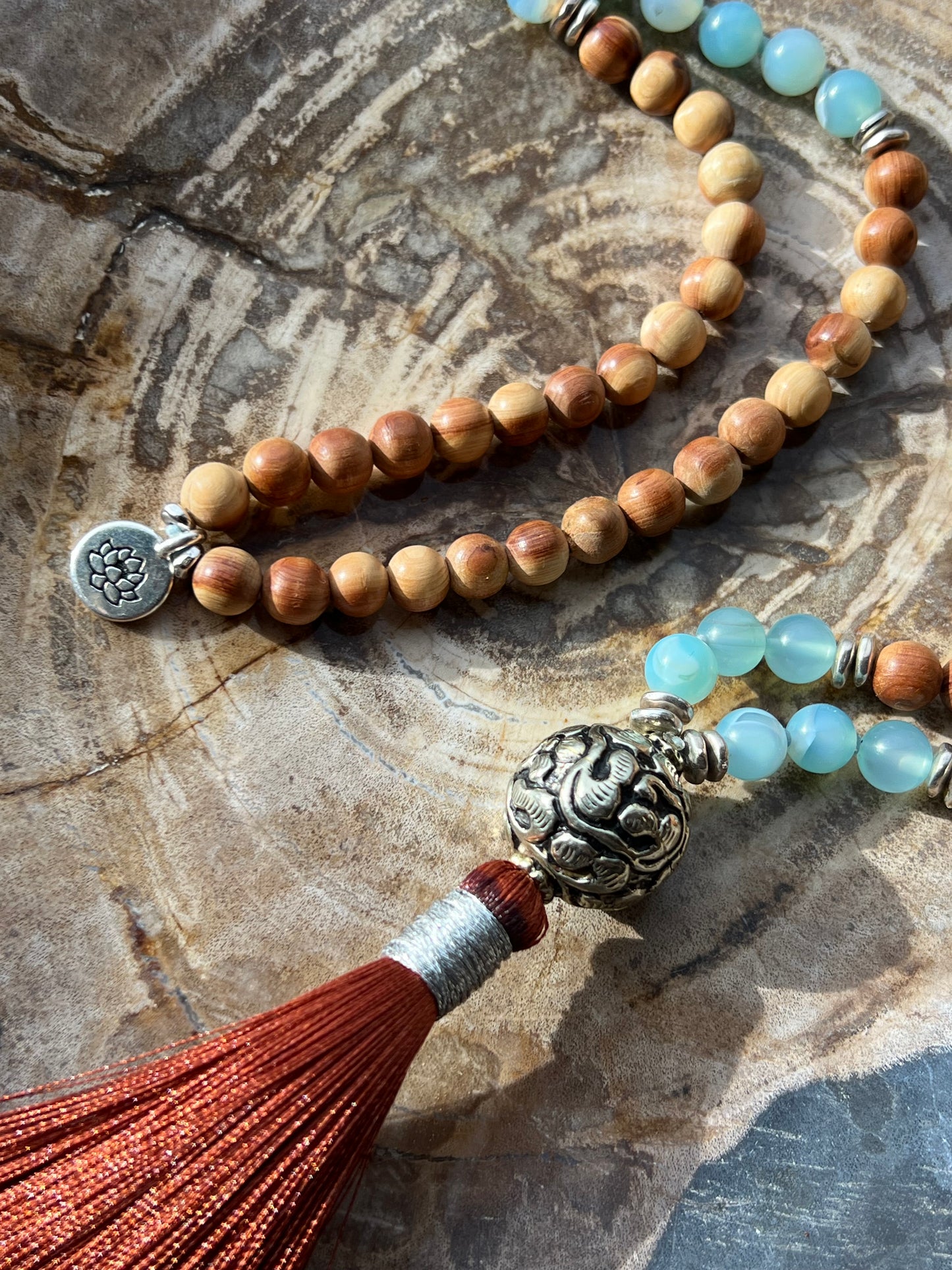 Mālā with Lake Blue Agate and Pearwood Beads with a Nepalese Silver Guru Bead, and a silky Tassel