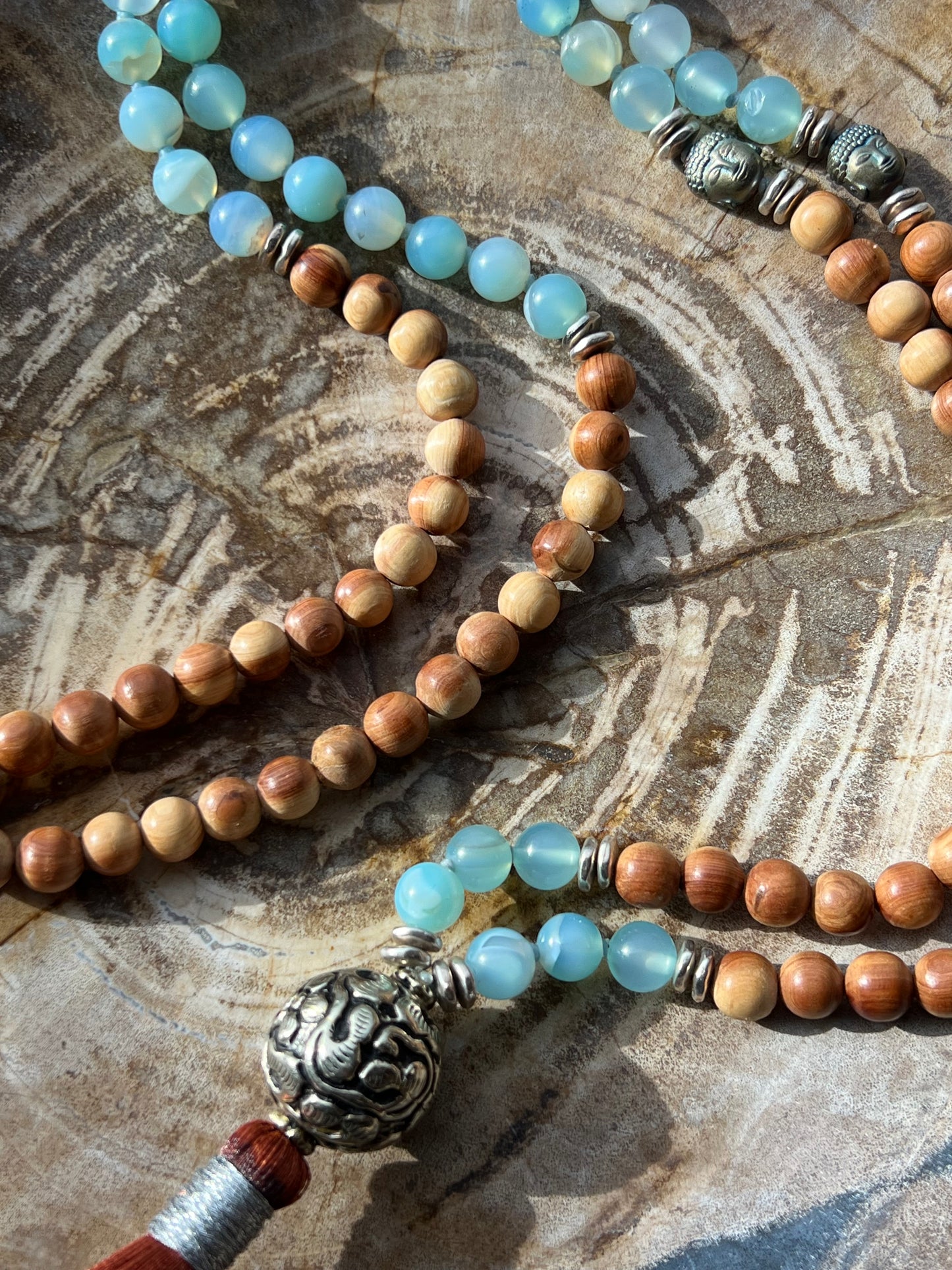 Mālā with Lake Blue Agate and Pearwood Beads with a Nepalese Silver Guru Bead, and a silky Tassel