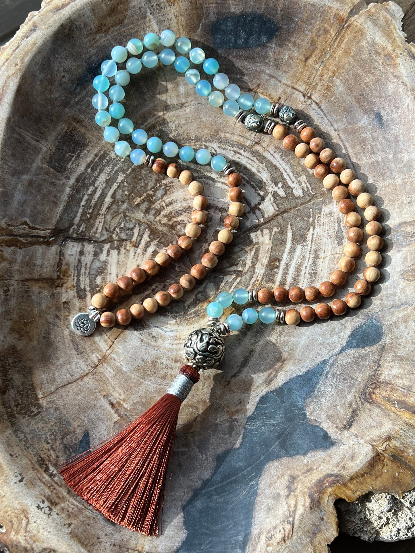 Mālā with Lake Blue Agate and Pearwood Beads with a Nepalese Silver Guru Bead, and a silky Tassel