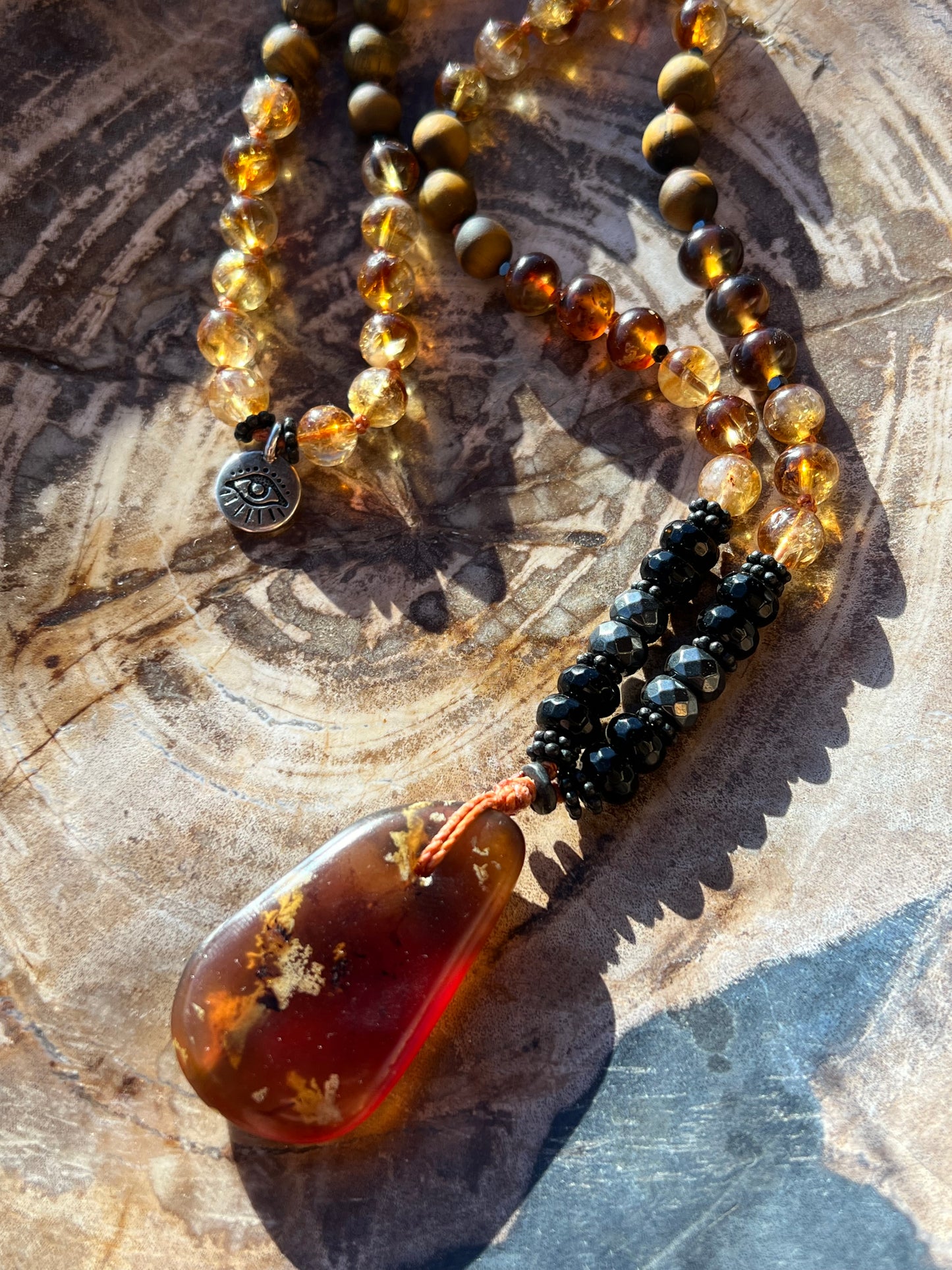 Mālā with Rare Blue Amber, Citrine, Tigerseye and Onyx Beads with a Blue Amber Pendant
