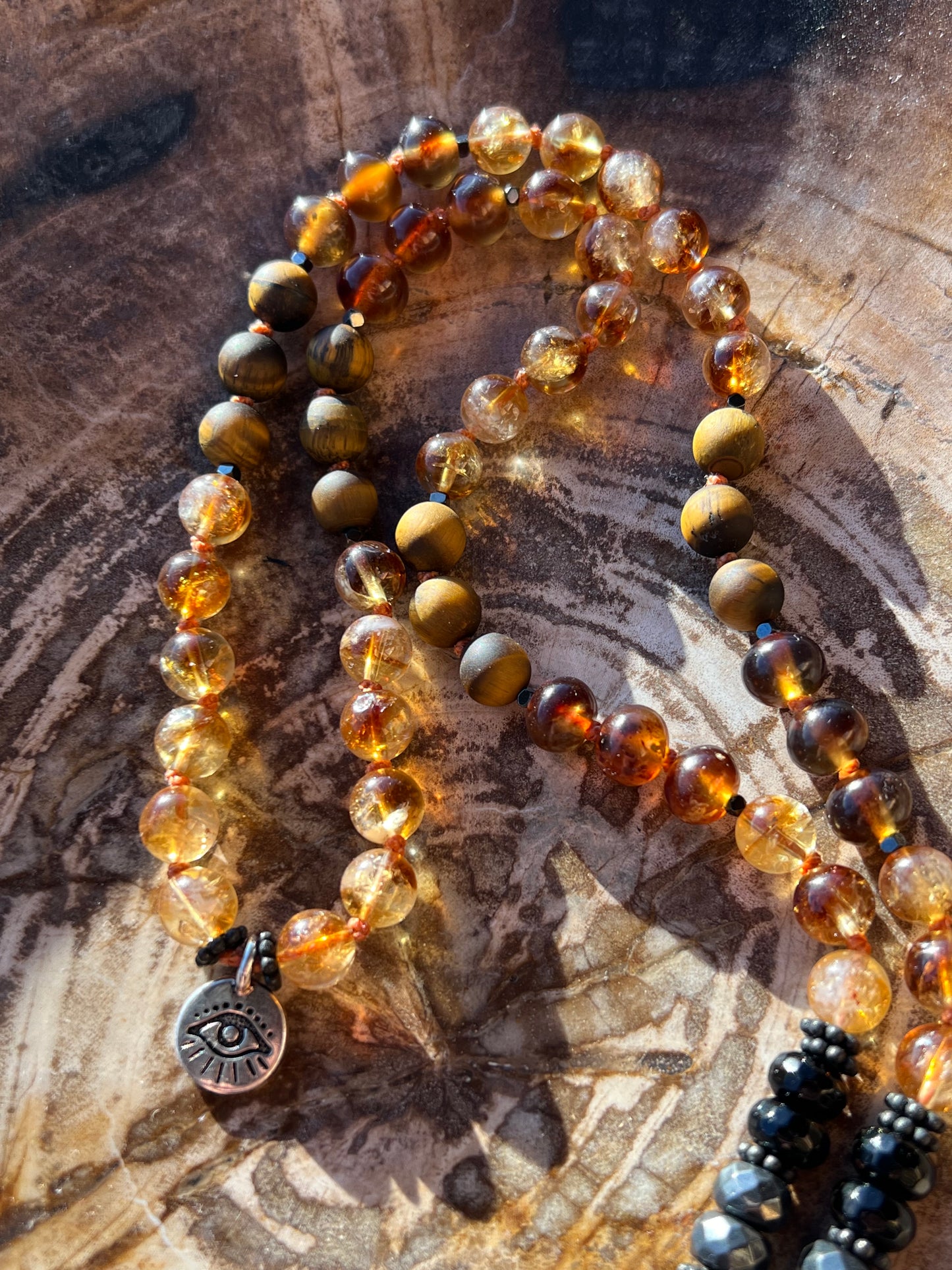 Mālā with Rare Blue Amber, Citrine, Tigerseye and Onyx Beads with a Blue Amber Pendant