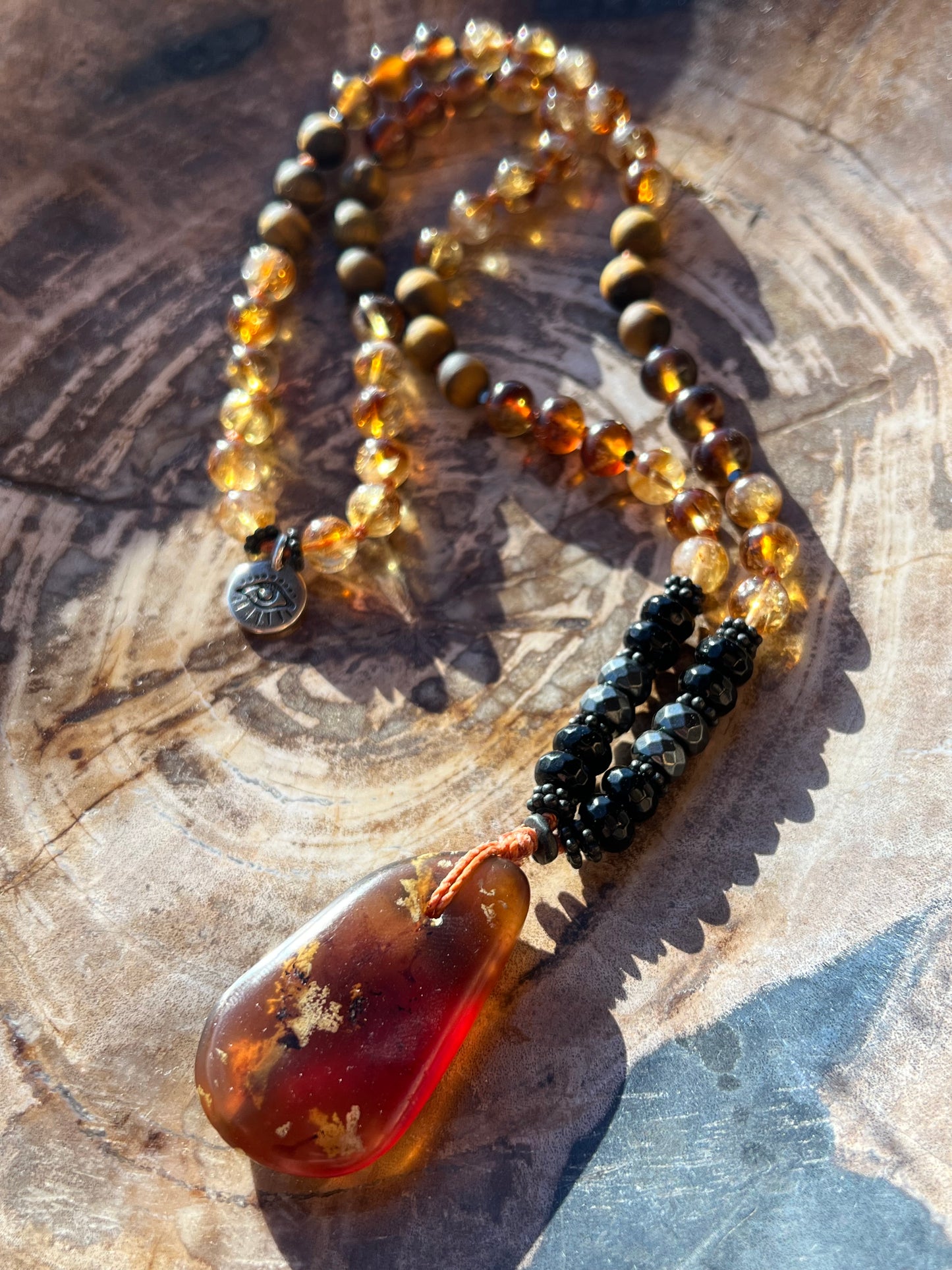 Mālā with Rare Blue Amber, Citrine, Tigerseye and Onyx Beads with a Blue Amber Pendant