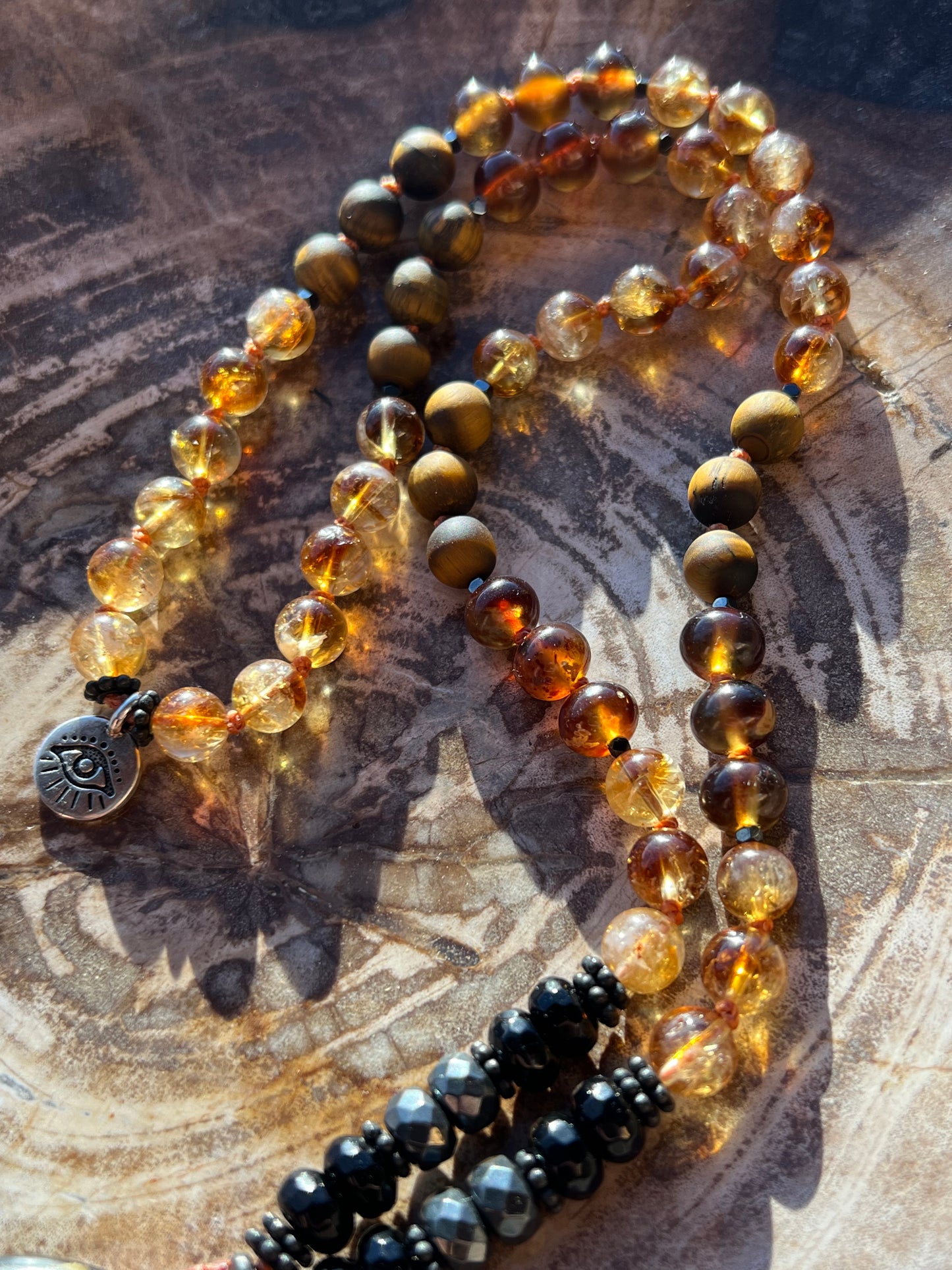 Mālā with Rare Blue Amber, Citrine, Tigerseye and Onyx Beads with a Blue Amber Pendant