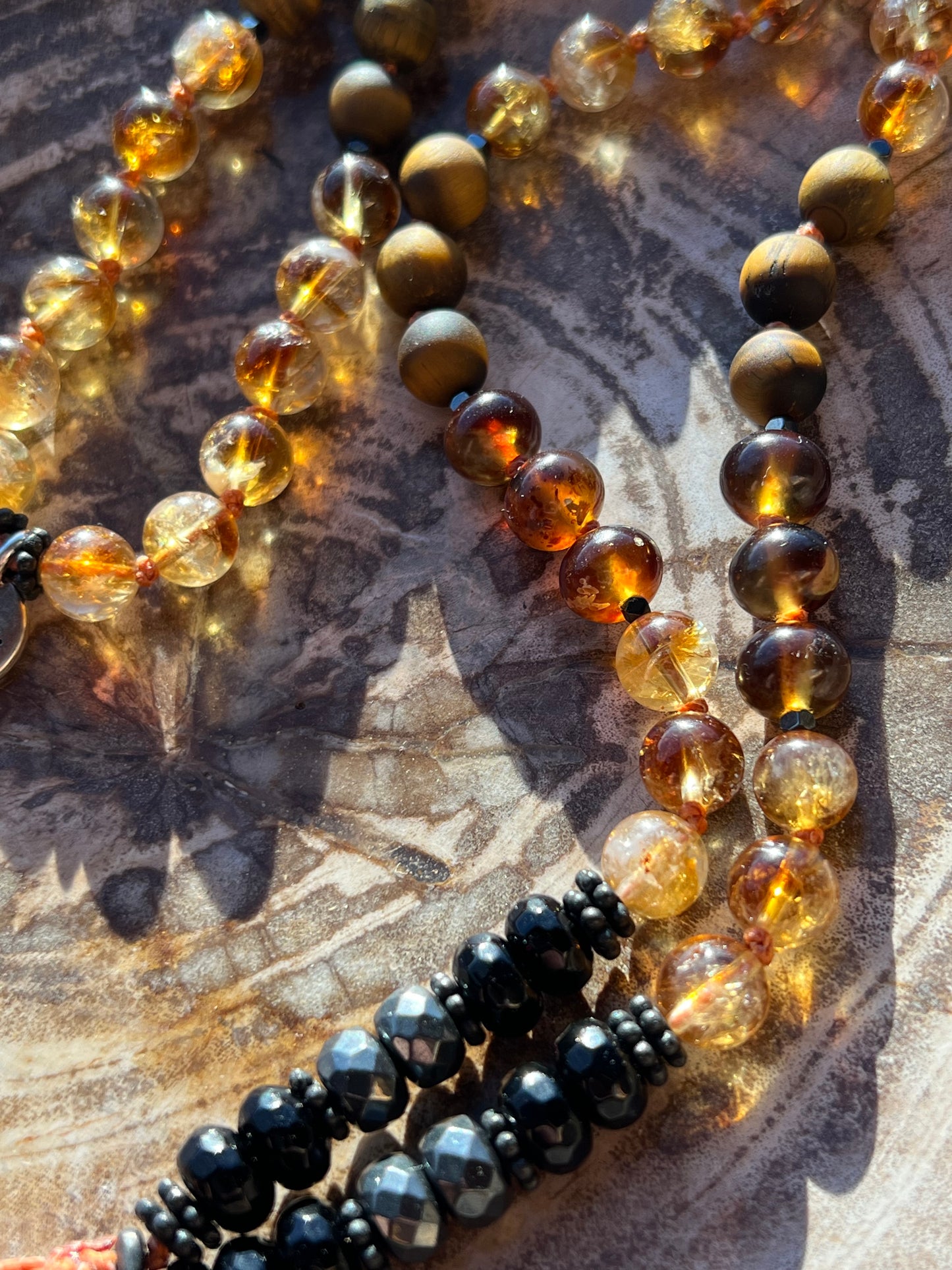 Mālā with Rare Blue Amber, Citrine, Tigerseye and Onyx Beads with a Blue Amber Pendant