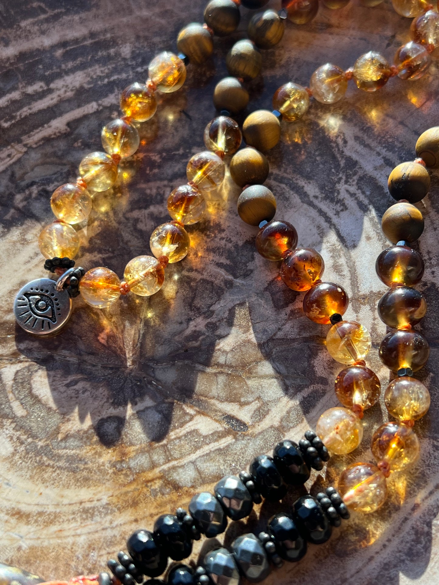 Mālā with Rare Blue Amber, Citrine, Tigerseye and Onyx Beads with a Blue Amber Pendant
