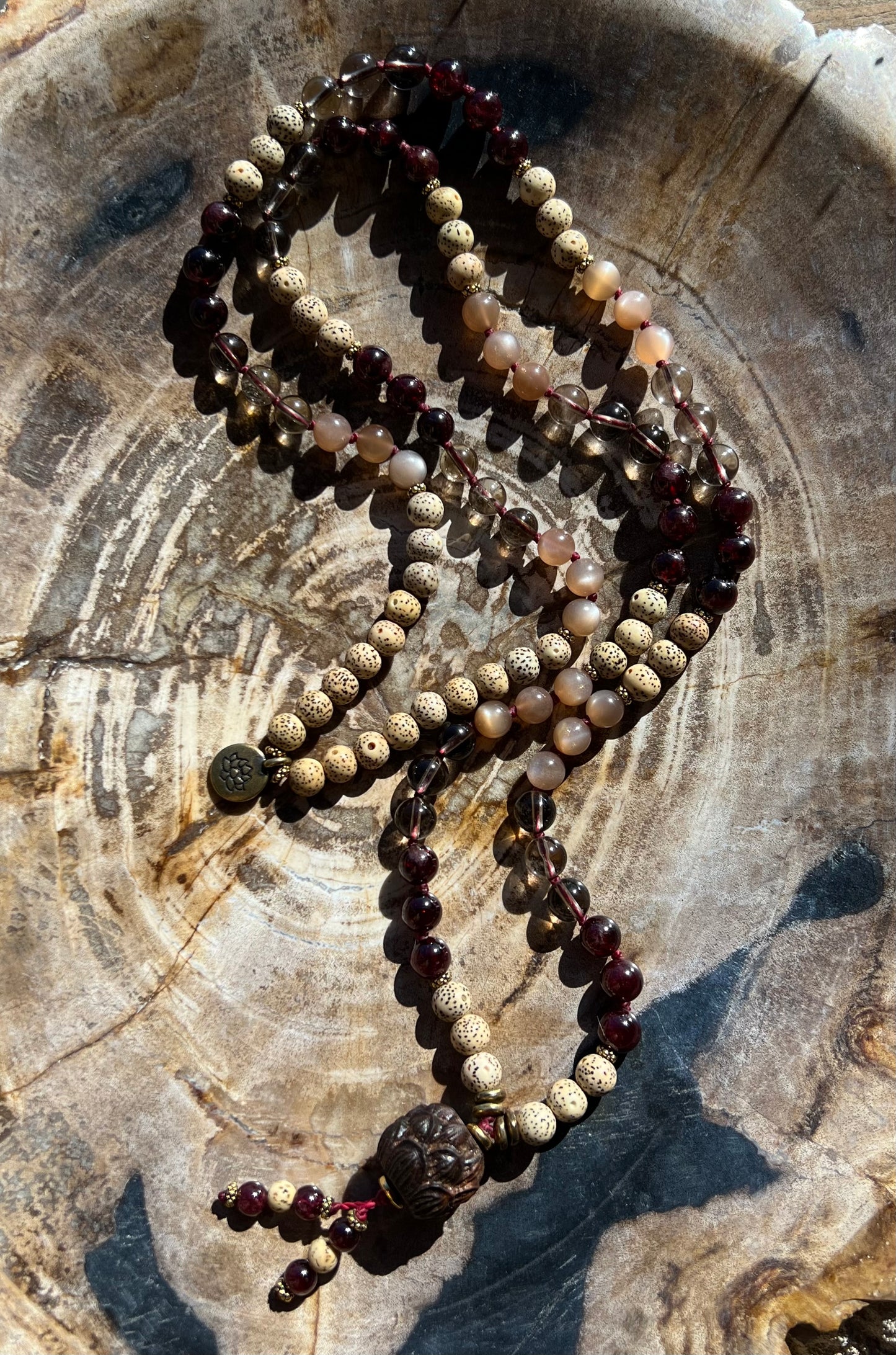 Mālā with Garnet, Smoky Quartz, Sunstone and Lotus Seed Beads with a Carved Lotus Guru Bead/ Pendant