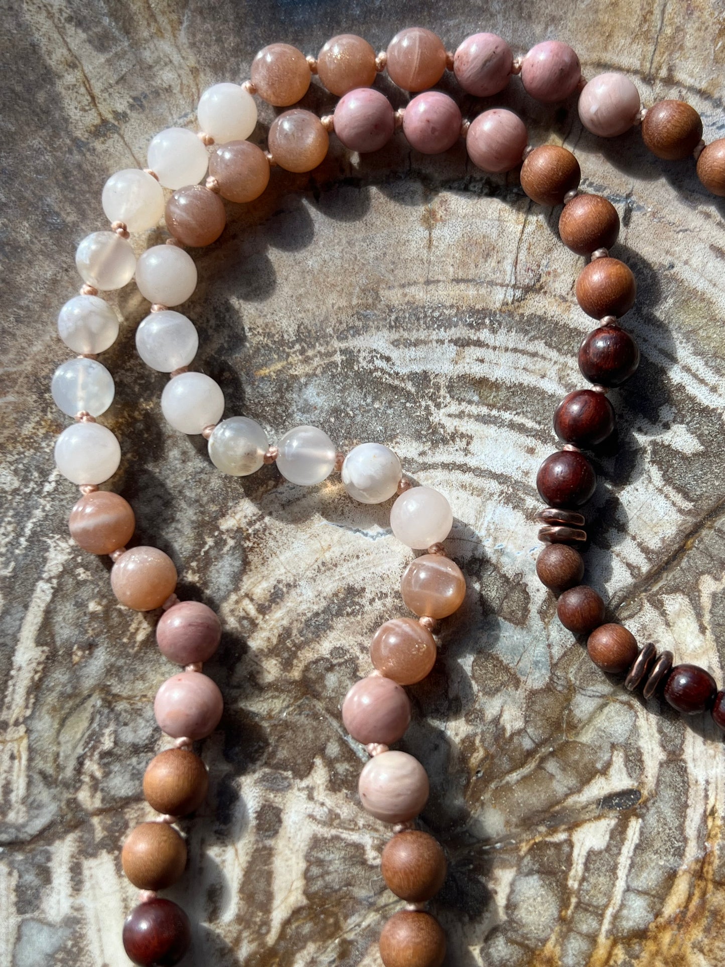 Half Mālā with Sunstone, Haitian Flower Rhodonite and Cherry Blossom Agate, Sandalwood, Indian Rosewood and Peach Aventurine with a Thai Buddha Pendant