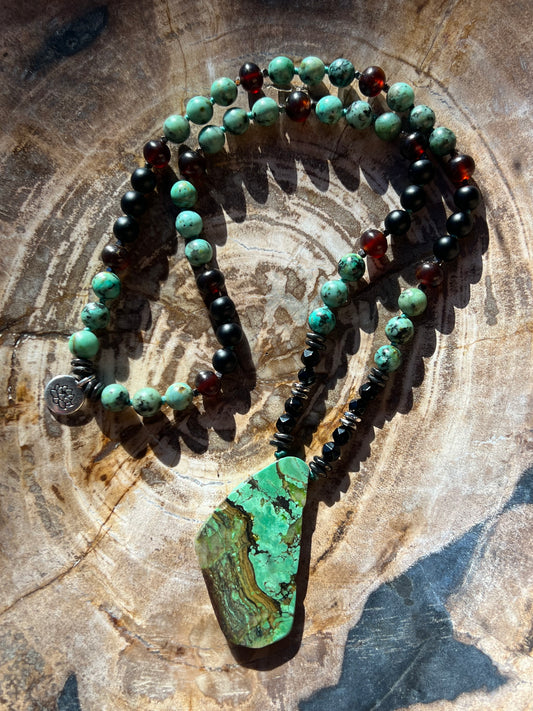 Mālā with Rare Blue Amber, African Turquoise and Onyx Beads with a genuine Green Turquoise Pendant