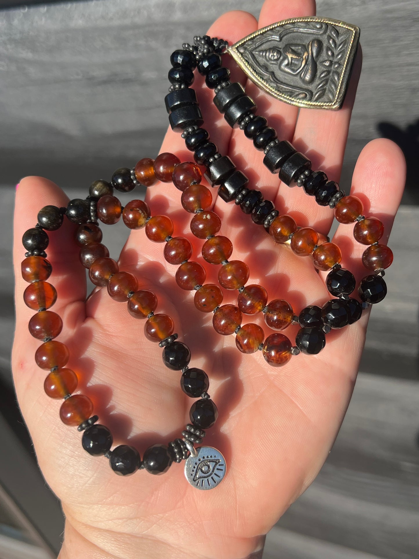 Mālā with Rare Blue Amber, Golden Sheen Obsidian and Onyx Beads with a Thai Buddha Pendant