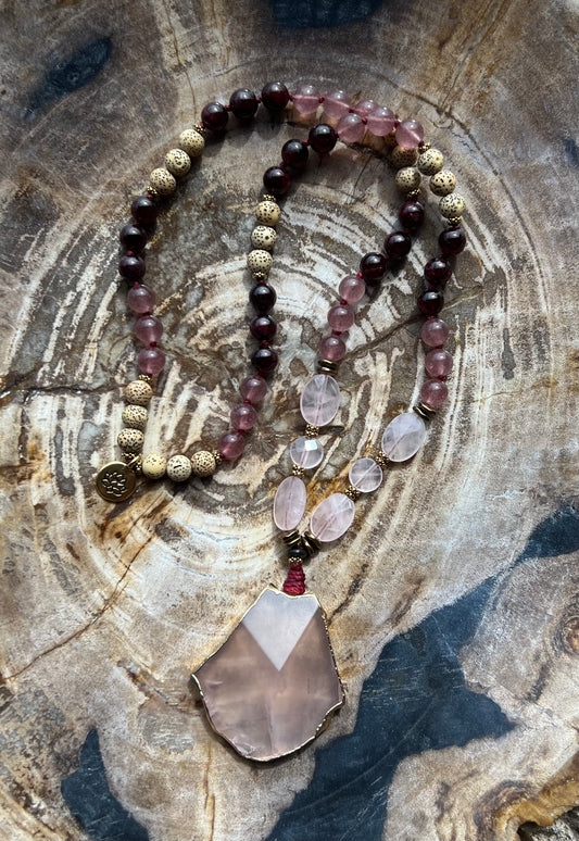 Mālā with Garnet, Tanzberry and Lotus Seed Beads with a Girasol Rose Quartz Pendant